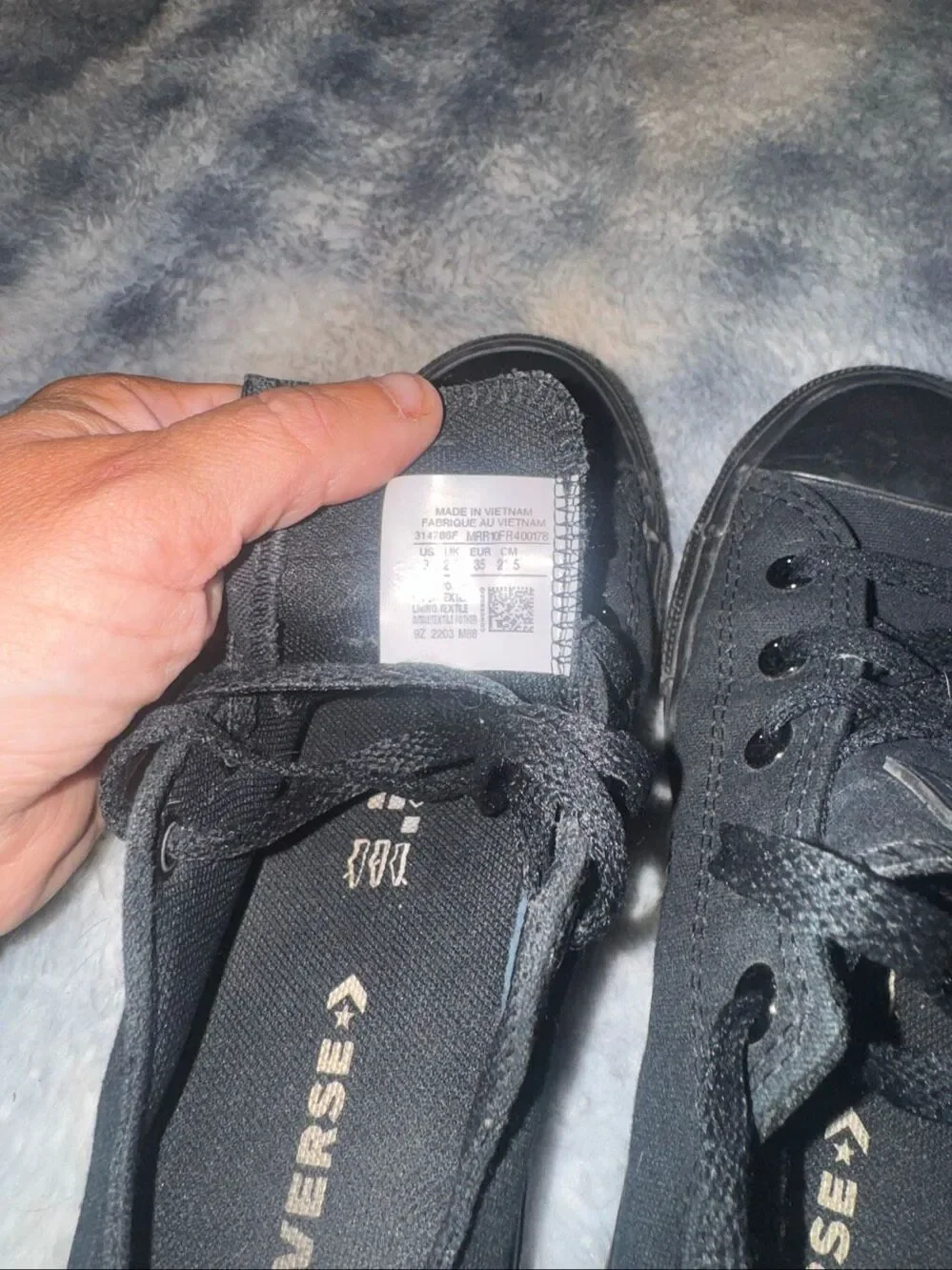 All black low top Converses size youth 3